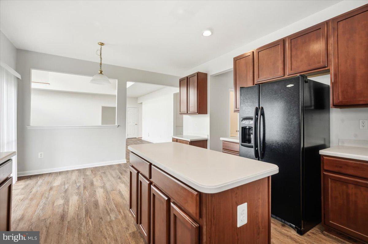 27 Sparkling Brook Road Ranson, WV 25438 - Photo 13 of 50 Modern kitchen with rich wood accents.