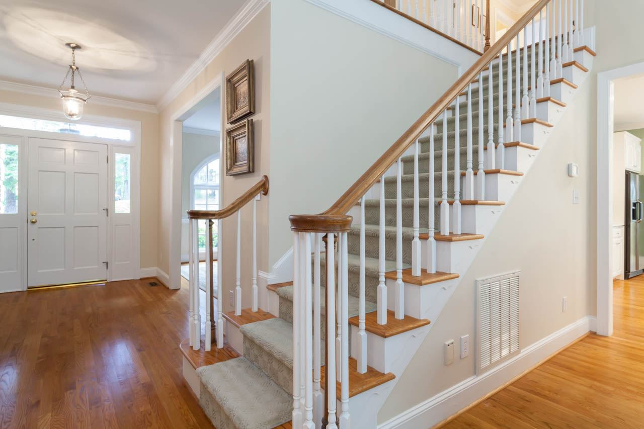 13921 Possum Track Road Raleigh, NC 27614 - Photo 7 of 25 Beautiful view of the staircase leading to the second floor and additional bedrooms and bonus area. Foyer