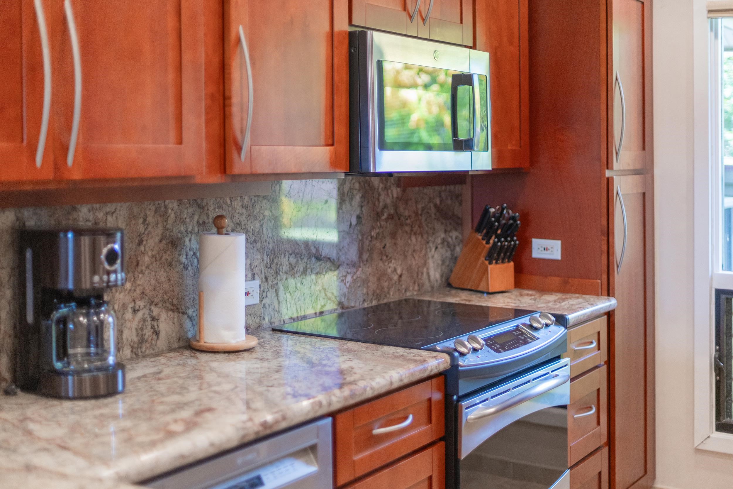 100 Ridge Road, Unit 723 Lahaina, HI 96761 - Photo 12 of 48 a kitchen with a sink cabinets and appliances