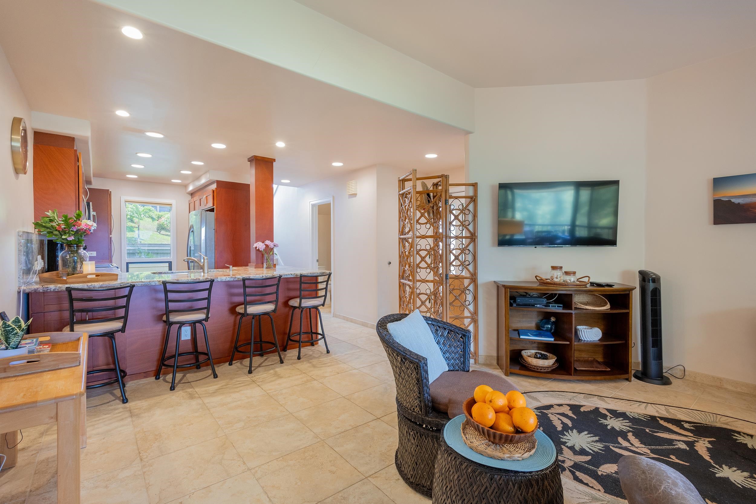 100 Ridge Road, Unit 723 Lahaina, HI 96761 - Photo 16 of 48 a living room with furniture and a flat screen tv