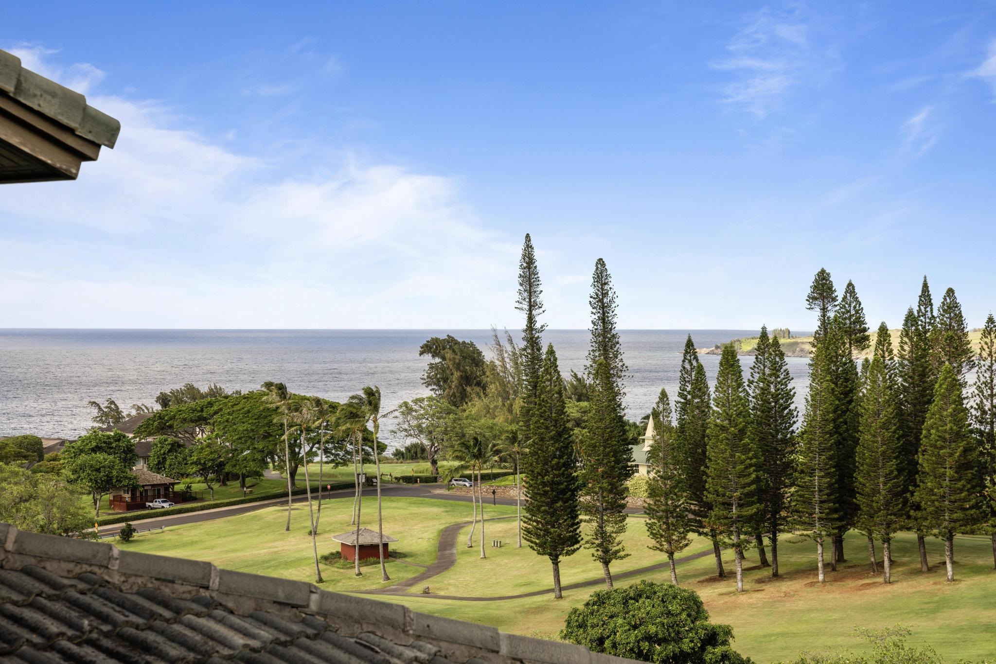 100 Ridge Road, Unit 723 Lahaina, HI 96761 - Photo 17 of 48 a view of a swimming pool with an outdoor seating and a floor to ceiling window