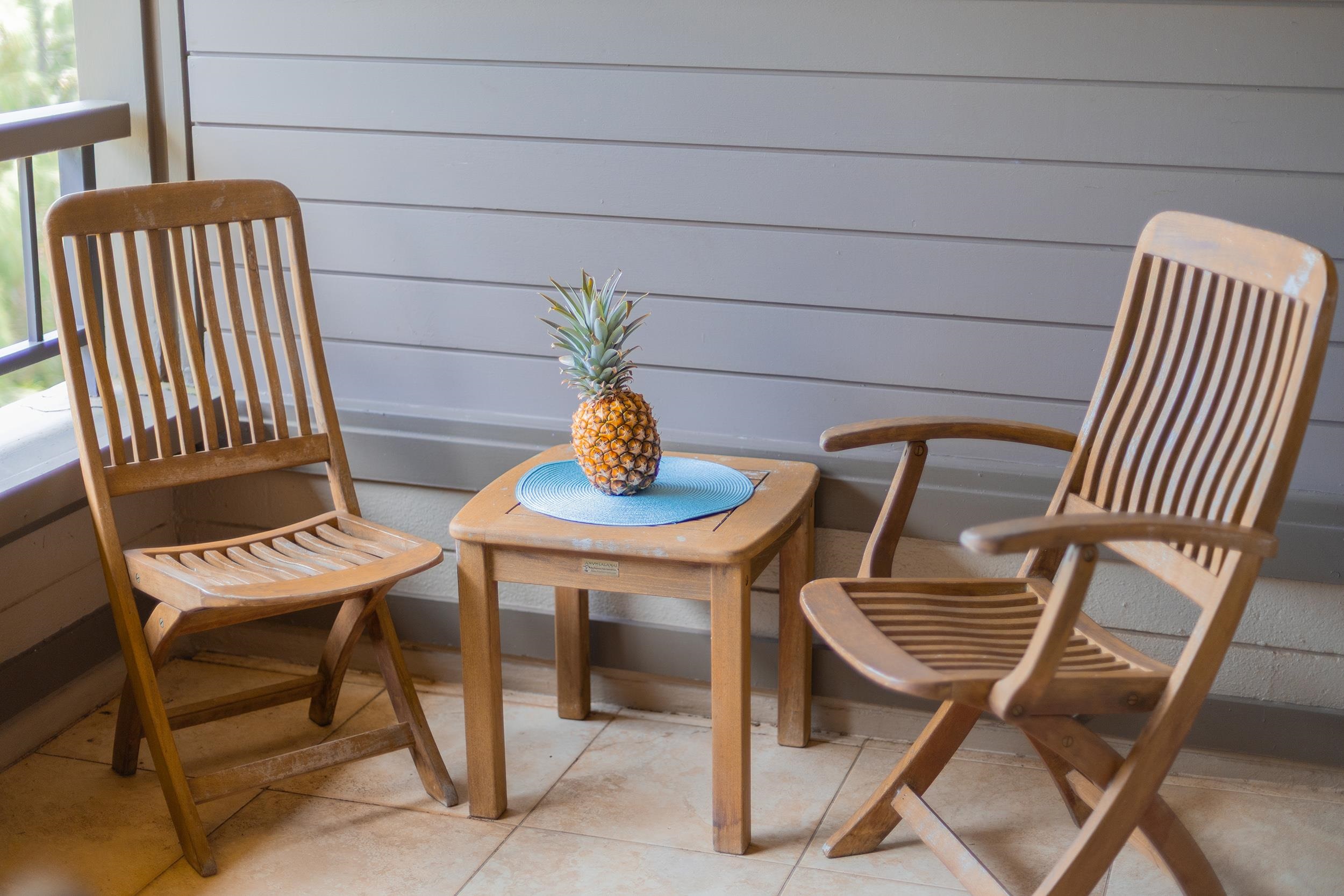 100 Ridge Road, Unit 723 Lahaina, HI 96761 - Photo 18 of 48 a view of a chairs and table in the terrace