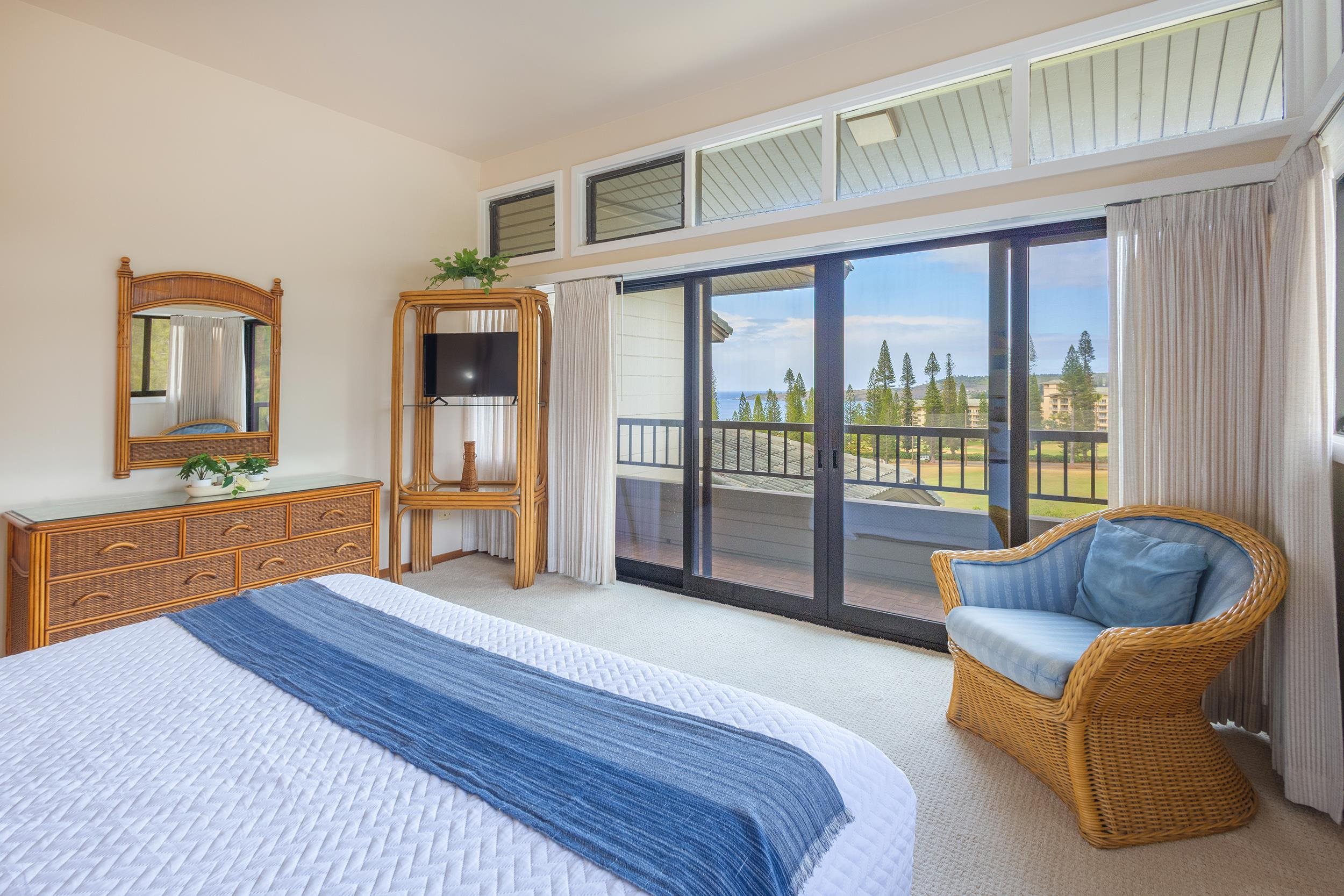 100 Ridge Road, Unit 723 Lahaina, HI 96761 - Photo 23 of 48 a spacious bedroom with a bed and a couch