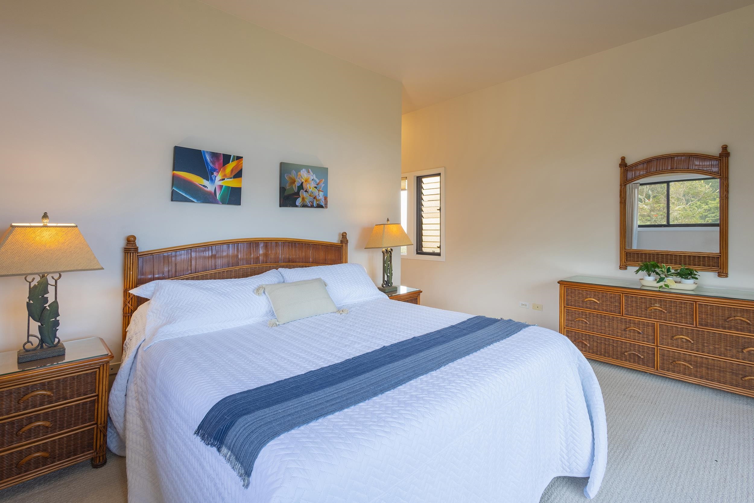 100 Ridge Road, Unit 723 Lahaina, HI 96761 - Photo 25 of 48 a bedroom with a bed and a dresser