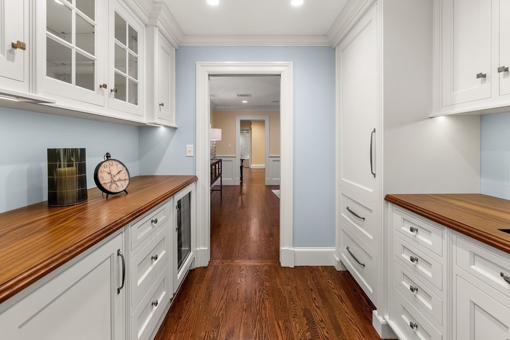 61 Possum Road Weston, MA 02493 - Photo 20 of 42 a kitchen with cabinets and wooden floor