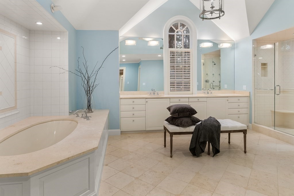 61 Possum Road Weston, MA 02493 - Photo 24 of 42 a bathroom with a sink mirror and a bathtub
