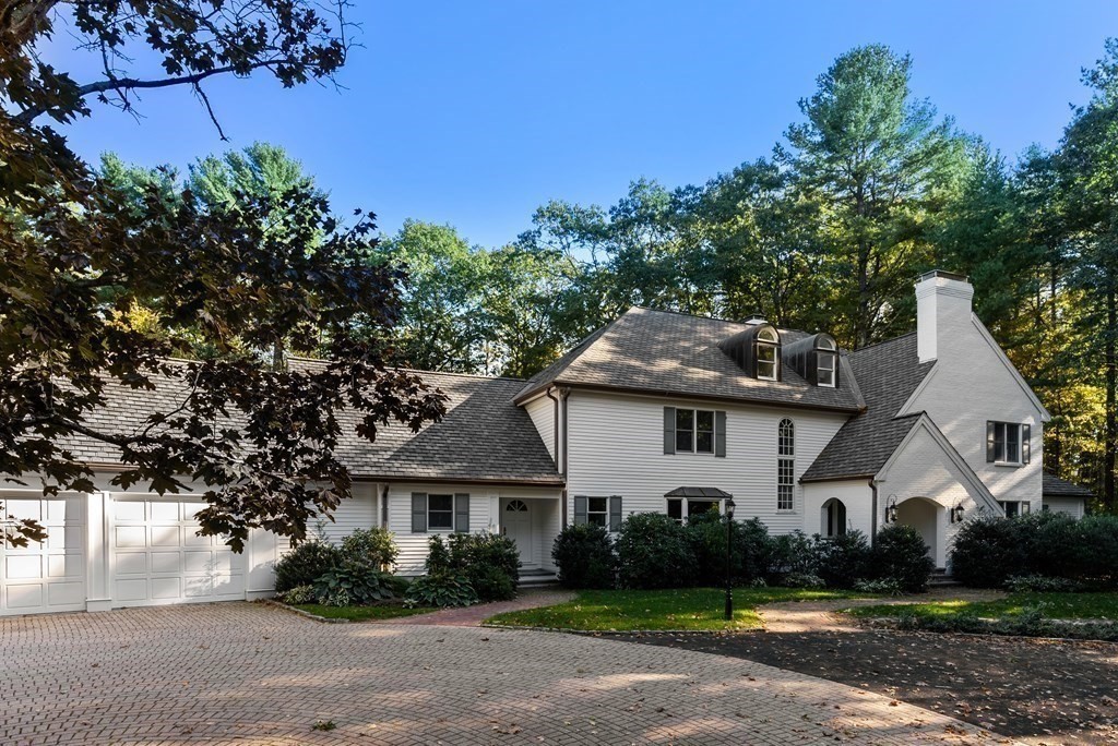 61 Possum Road Weston, MA 02493 - Photo 40 of 42 a front view of a house with a garden
