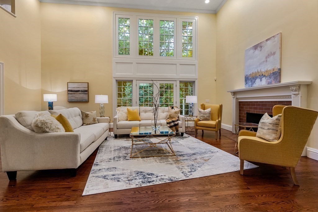 61 Possum Road Weston, MA 02493 - Photo 6 of 42 a living room with furniture and a fireplace