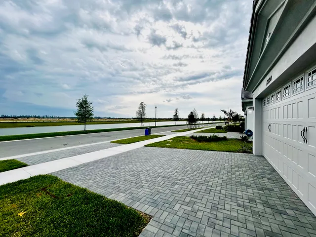 a view of a swimming pool with an outdoor seating