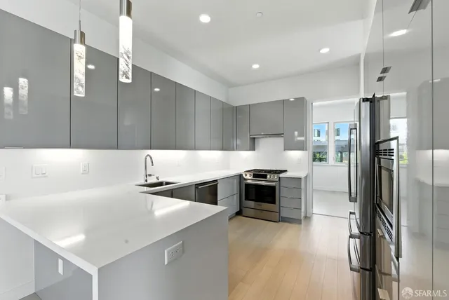 a kitchen with counter top space cabinets and stainless steel appliances