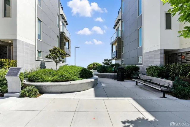 a view of a building with potted plants