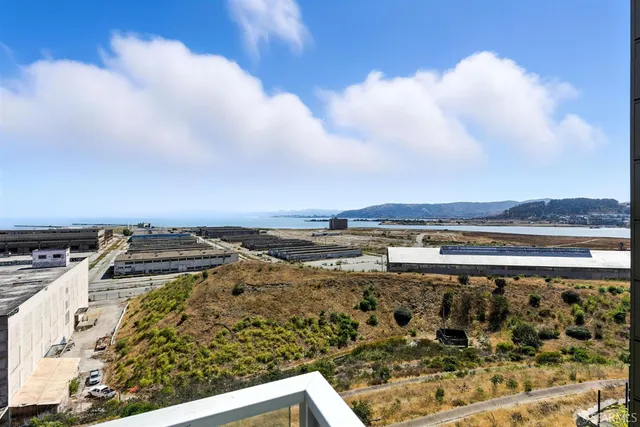 a white toilet sitting next to a shower
