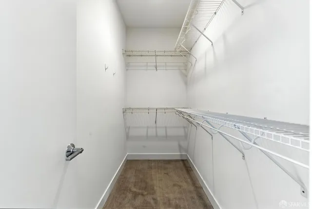 a large bathroom with a double vanity sink a large mirror and a shower