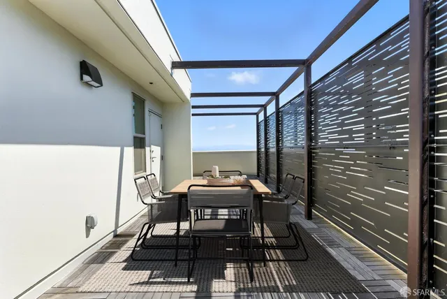 a view of a building with potted plants
