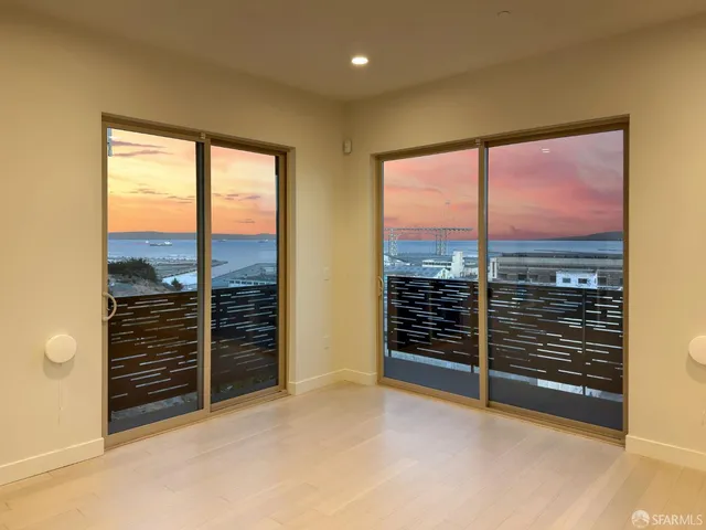 a kitchen with stainless steel appliances a sink stove and refrigerator
