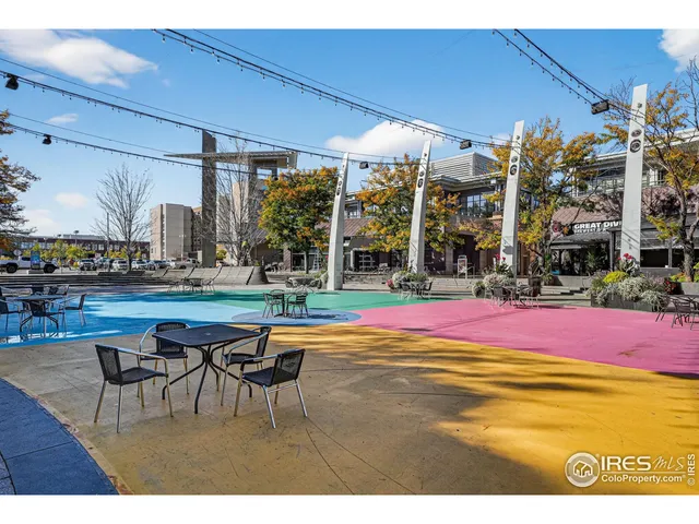 a swimming pool with outdoor seating and yard