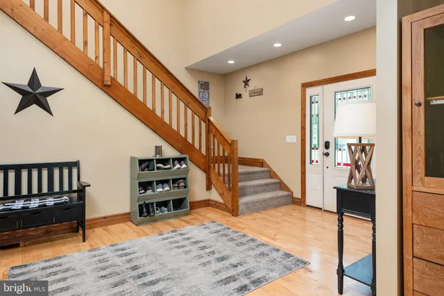 a kitchen with stainless steel appliances granite countertop a sink a stove and cabinets