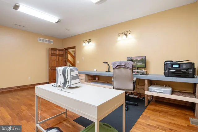 a kitchen with a sink vanity and mirror