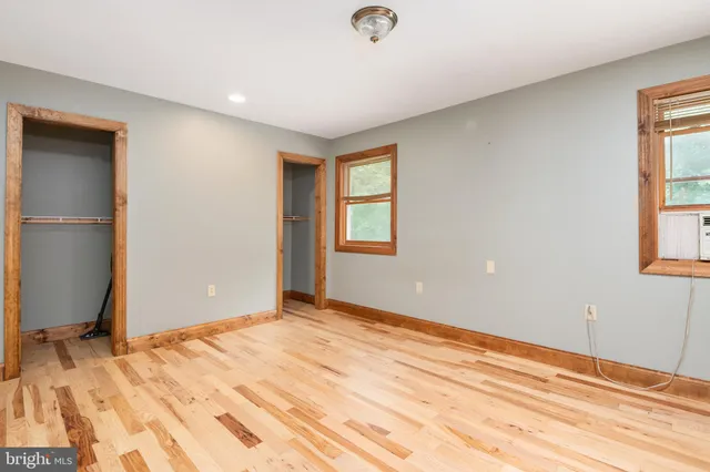 a bathroom with a sink toilet and a mirror