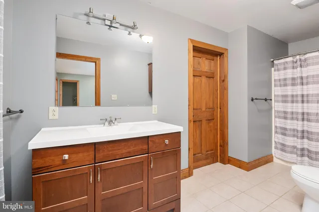 a bedroom with bed and window