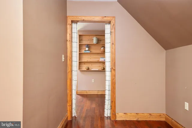 a front view of house with yard and trees
