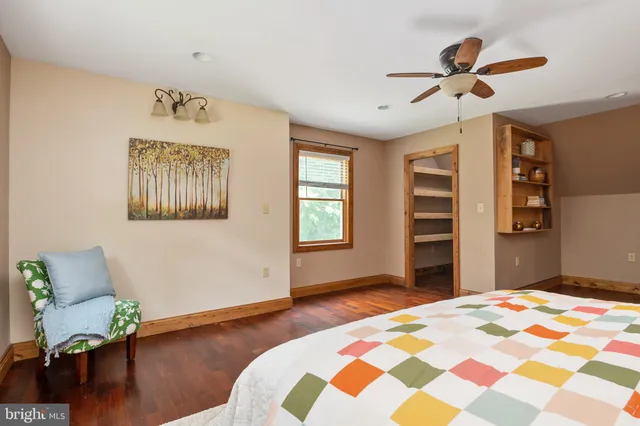 a view of backyard of house with green space