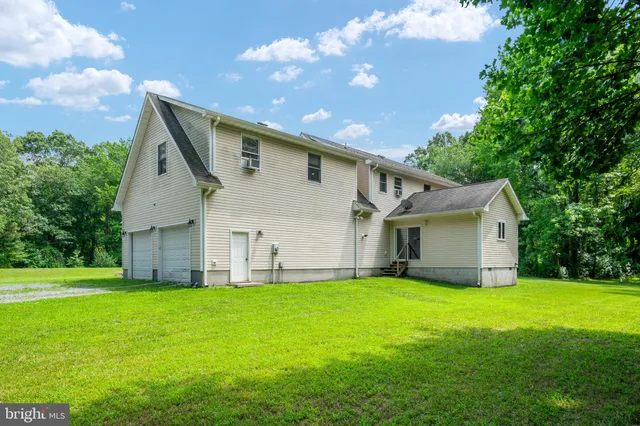a view of a garden with an outdoor seating