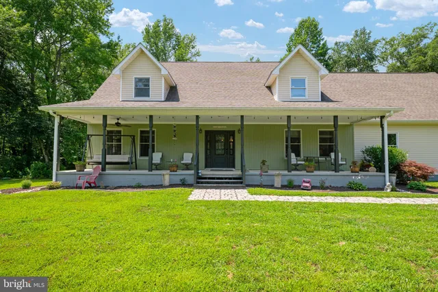 a view of a living room and floor to ceiling window and an mountain view