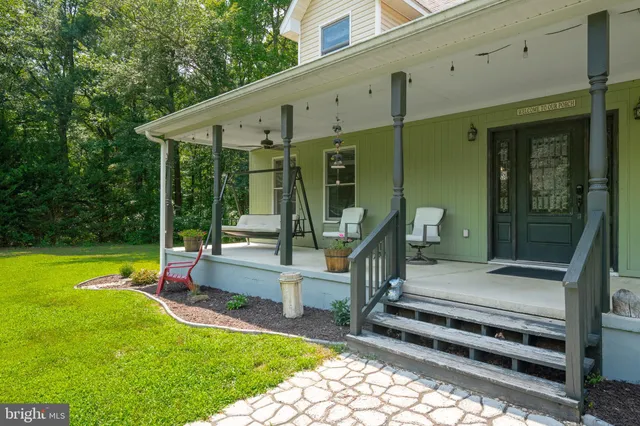an aerial view of a house with a swimming pool