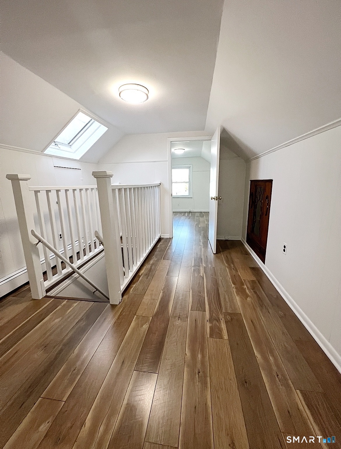 106 Lafayette Street, Unit 3 Stamford, CT 06902 - Photo 1 of 7 a view of a hallway with wooden floor