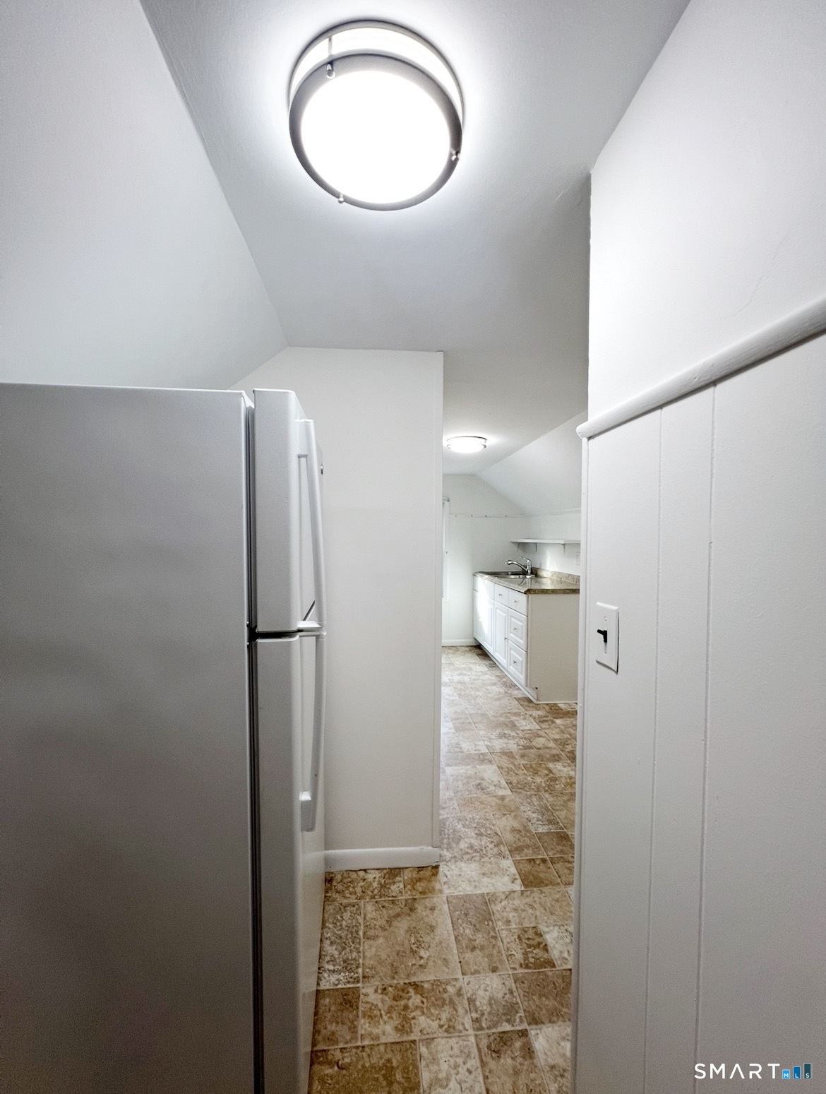 106 Lafayette Street, Unit 3 Stamford, CT 06902 - Photo 4 of 7 a bathroom with a granite countertop sink and a mirror