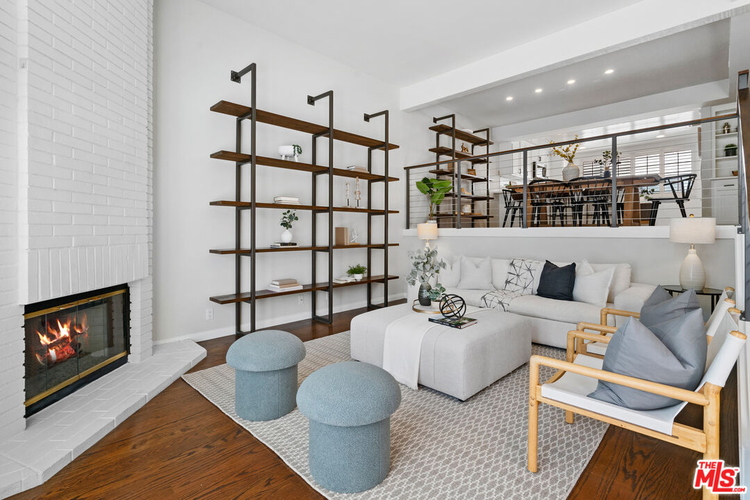 4421 Alla Road, Unit 3 Marina del Rey, CA 90292 - Photo 2 of 31 a living room with furniture a couch and a fireplace
