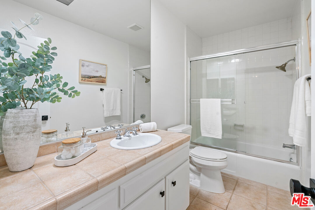 4421 Alla Road, Unit 3 Marina del Rey, CA 90292 - Photo 21 of 31 a bathroom with a granite countertop sink toilet and shower