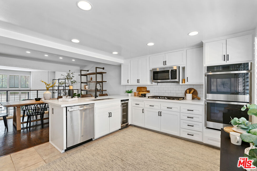 4421 Alla Road, Unit 3 Marina del Rey, CA 90292 - Photo 8 of 31 a kitchen with appliances a sink and cabinets