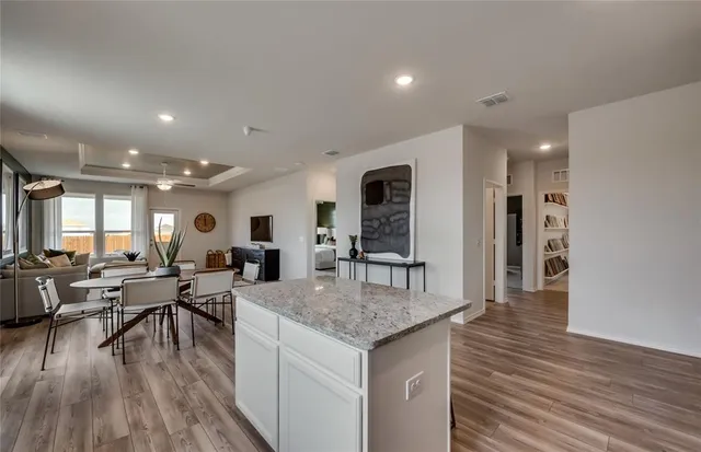 a view of a kitchen and dining room