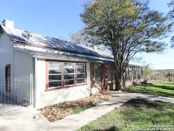 a house with trees in front of it