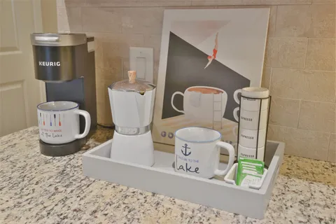 a bathroom with a toilet mirror and vanity