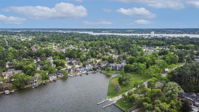 an aerial view of a city and lake view