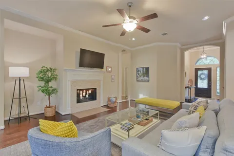 a living room with furniture fireplace and a flat screen tv
