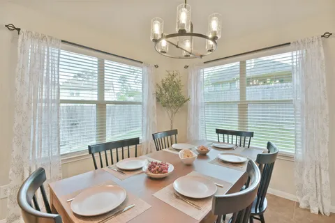 a kitchen with granite countertop a sink and a wooden floor