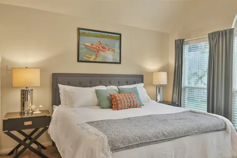 a dining room with furniture and window