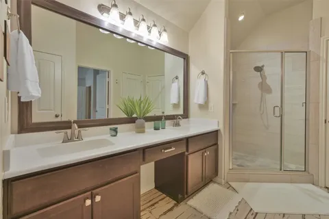 a bedroom with a bed and lamp