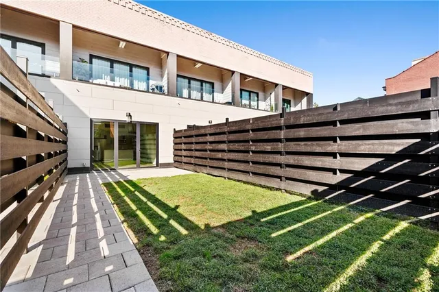 a view of a house with a backyard