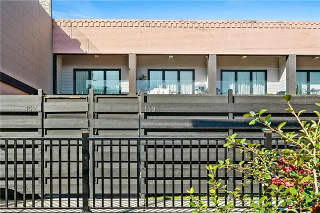 a front view of a house with glass windows