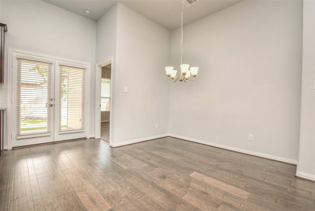 704 Bonnet Boulevard Georgetown, TX 78628 - Photo 15 of 40 Dining room area and the door leads to the big covered patio.