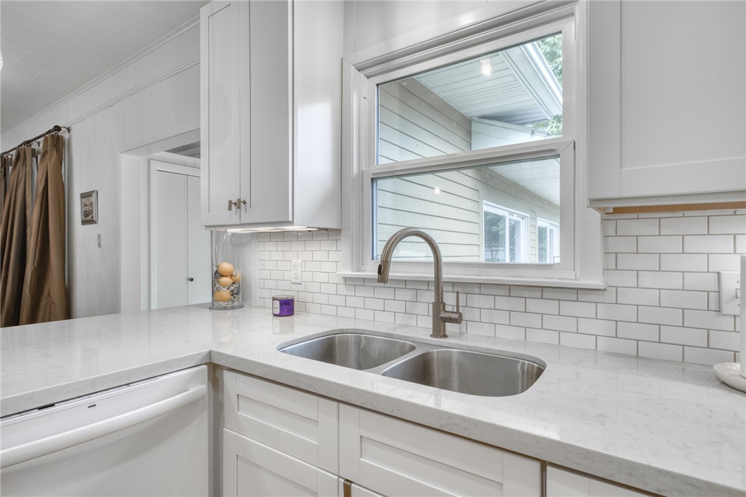 1524 Highway 159 Bellville, TX 77418 - Photo 11 of 33 a kitchen with a sink cabinets and a window