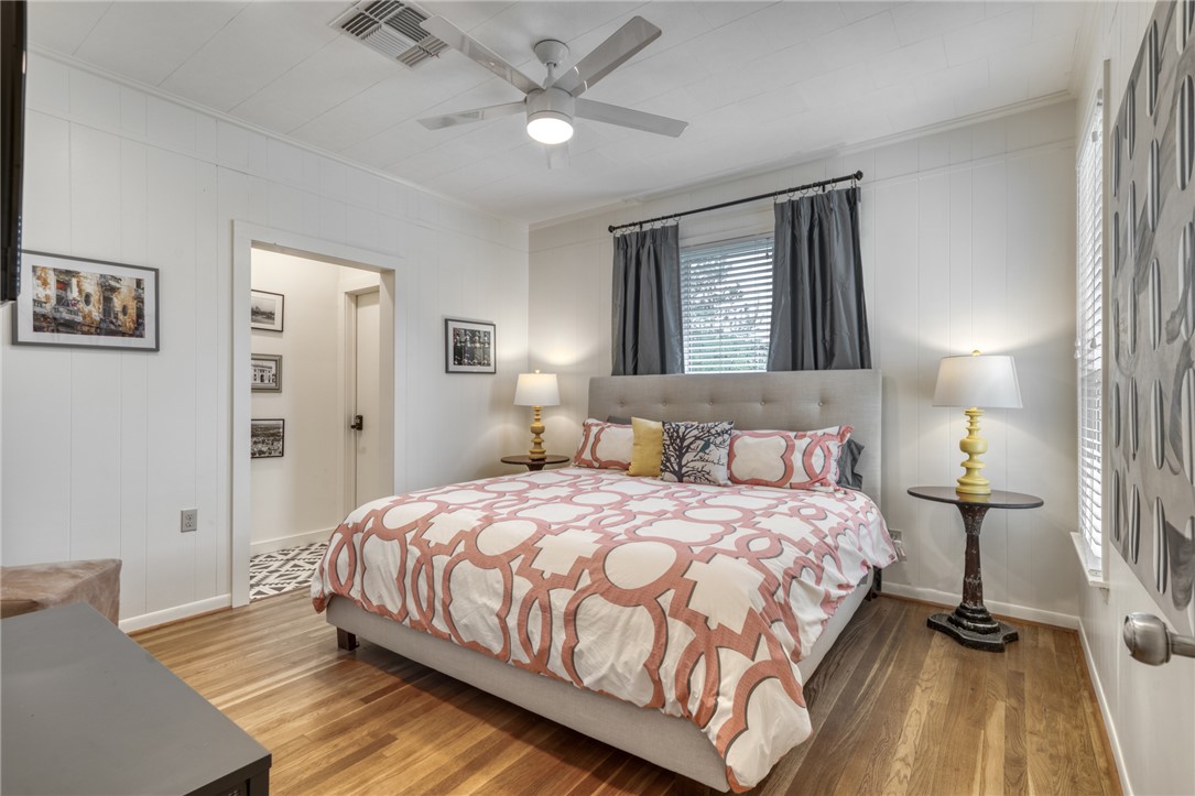 1524 Highway 159 Bellville, TX 77418 - Photo 13 of 33 a bedroom with a bed and a chandelier