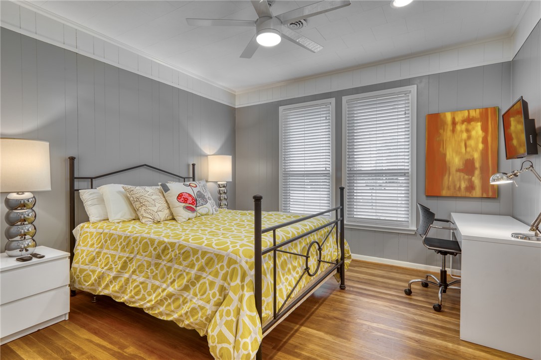 1524 Highway 159 Bellville, TX 77418 - Photo 19 of 33 a bedroom with a bed and wooden floor