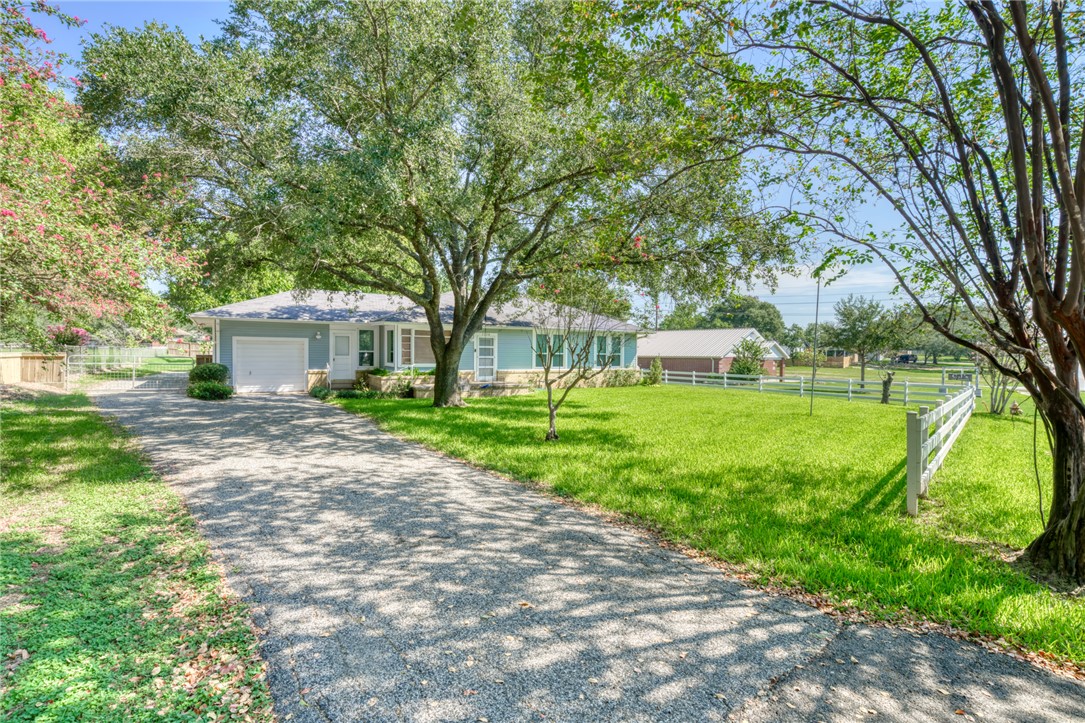 1524 Highway 159 Bellville, TX 77418 - Photo 2 of 33 a view of a house with backyard and a tree