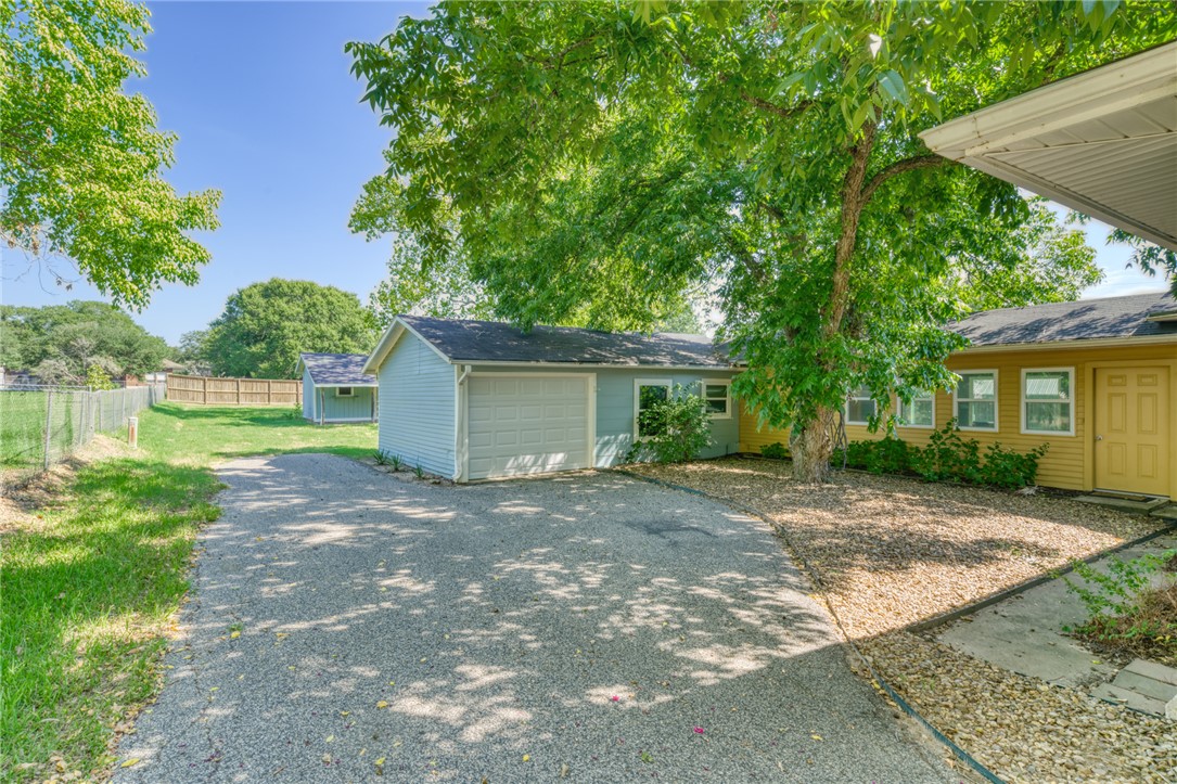 1524 Highway 159 Bellville, TX 77418 - Photo 24 of 33 a view of a house with yard and a tree